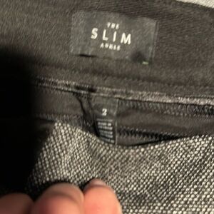 These are a tread pant with side black band on waist. Great for business casual.